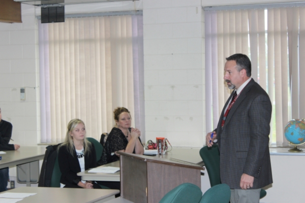 Marketing instructor talking to students